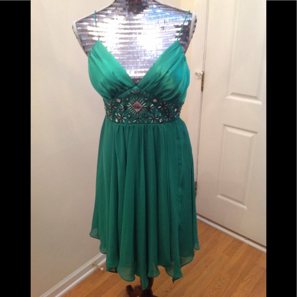 Short green cocktail dress.